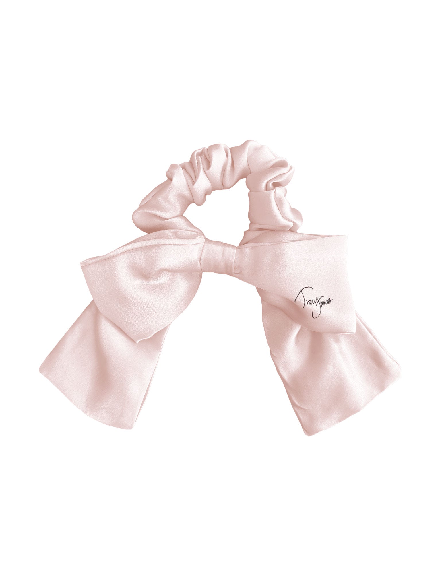 Pink silk bow scrunchie on a white background