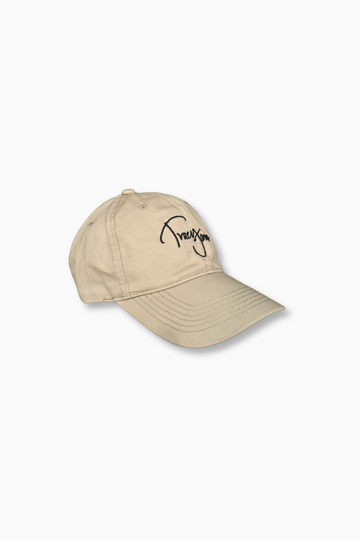 Tracy James Dad Hat in 100% Cotton Twill in khaki. TJ logo embroidered on front in black and Montecito embroidered at back. Adjustable fit.